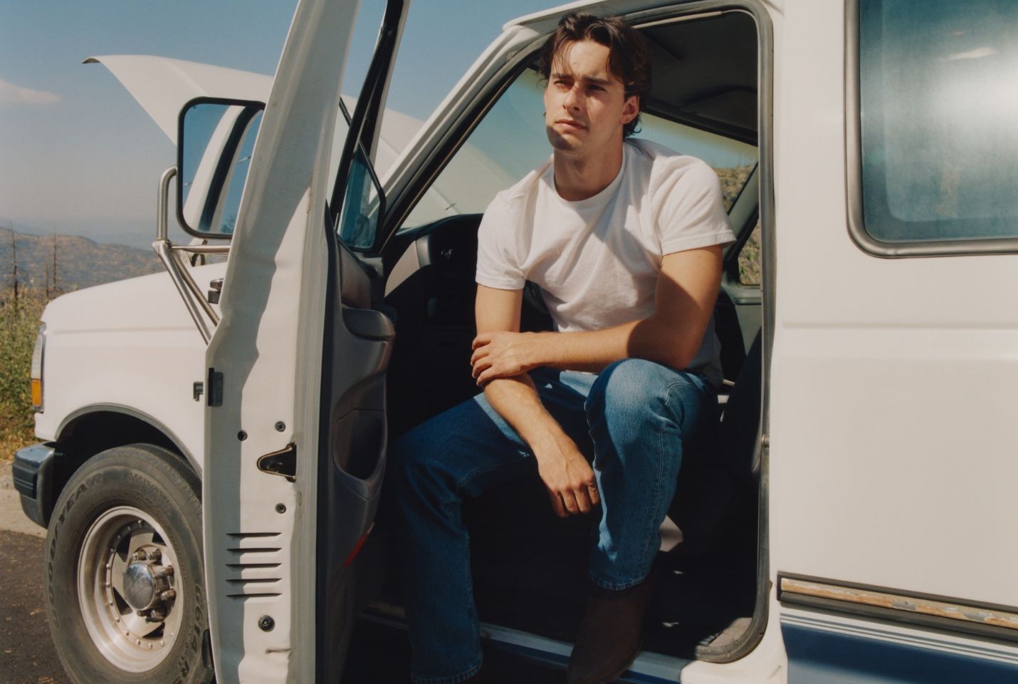 Noah Rinker sat in the drivers seat of a white vehicle